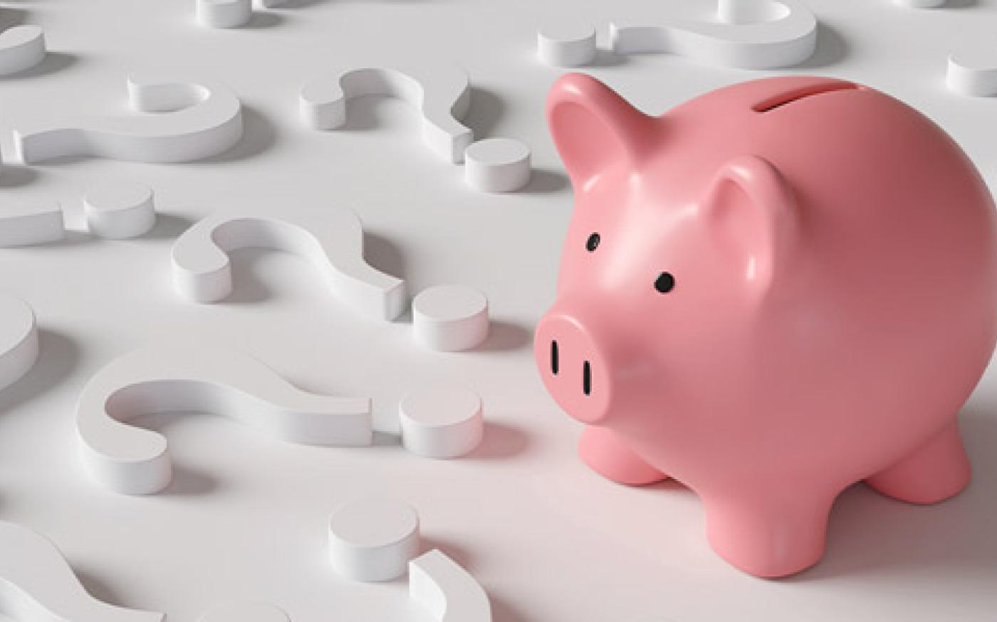 A piggy bank surrounded by question marks